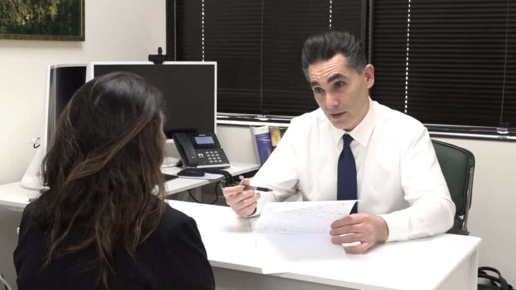 Dr. H. Reza Zahiri speaking with a patient