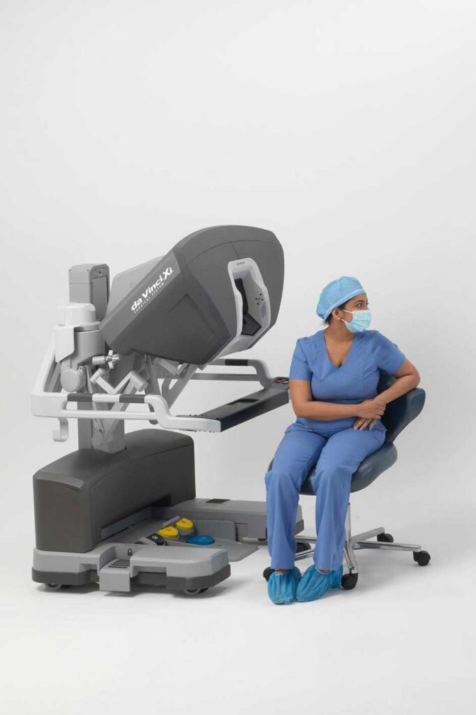 Surgeon sitting at a robotic surgery console